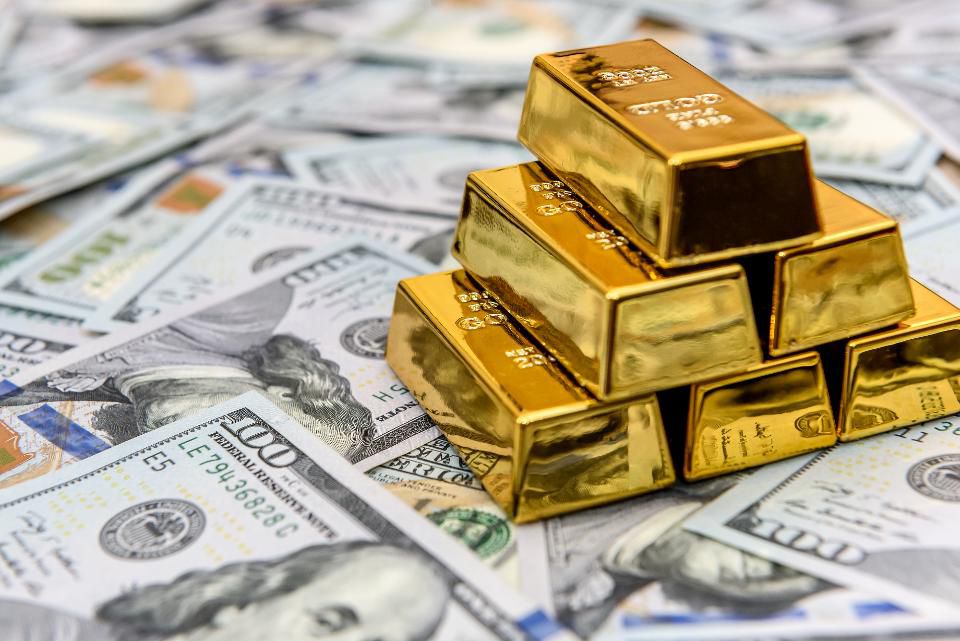 The rise in gold prices hit a new high in nearly nine years, as the U.S. dollar fell to a two-year low and the market expected more stimulus measures