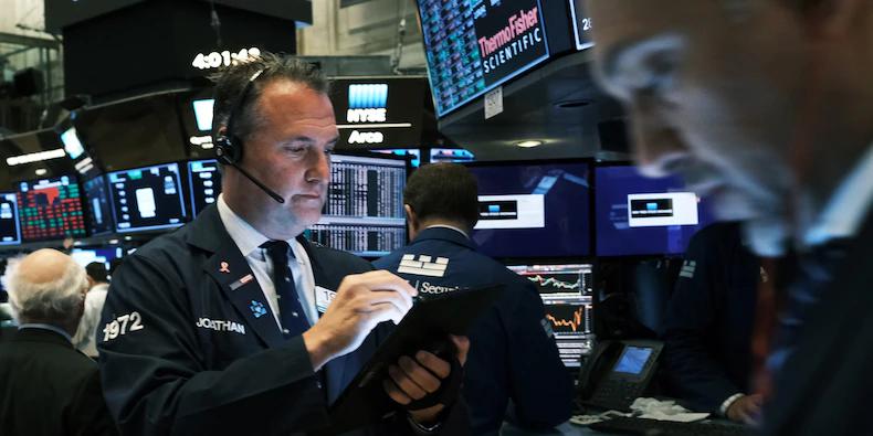 Stocks slip from records as optimism over economic recovery pauses